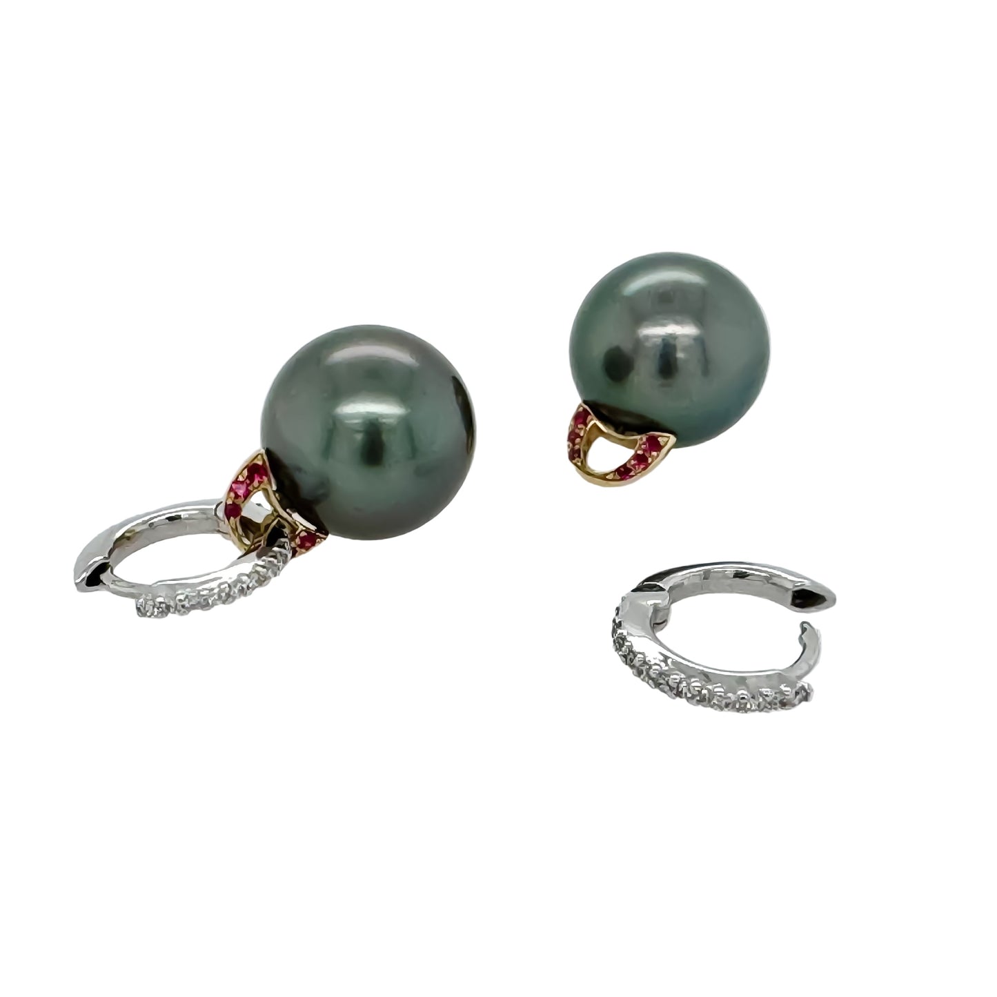 Close-up of 12.5mm Tahitian pearl earring with ruby bail and diamond hoop