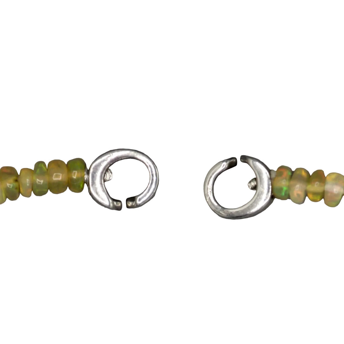 9.6mm Tahitian cultured pearl close-up, dark peacock luster with opal accent