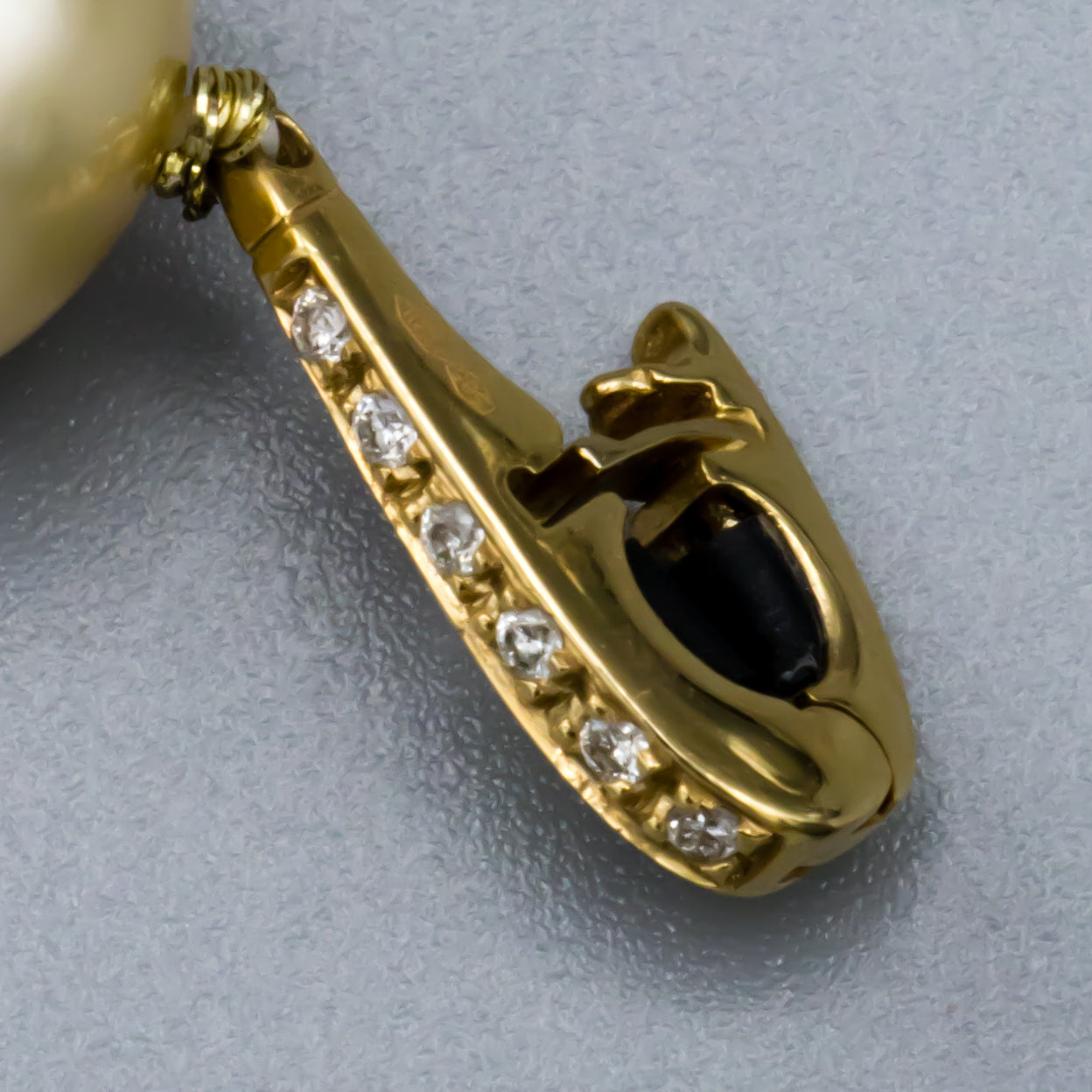 14K yellow gold diamond clasp detail on Tahitian and South Sea pearl necklace