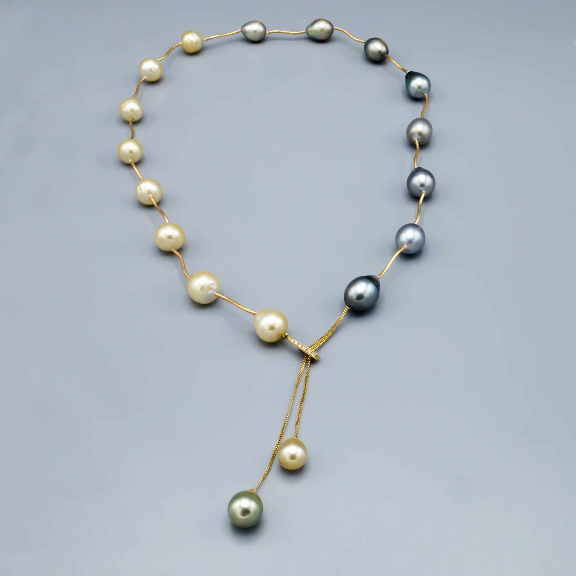 Mixed Tahitian and golden baroque pearl necklace with 14K gold spacers - close up