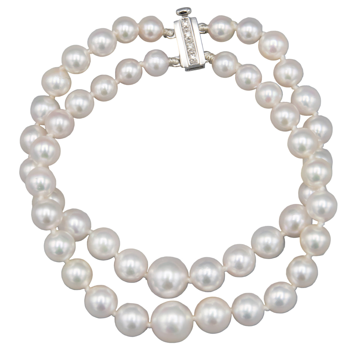 Akoya pearl double strand bracelet with 14K white gold diamond clasp on white background