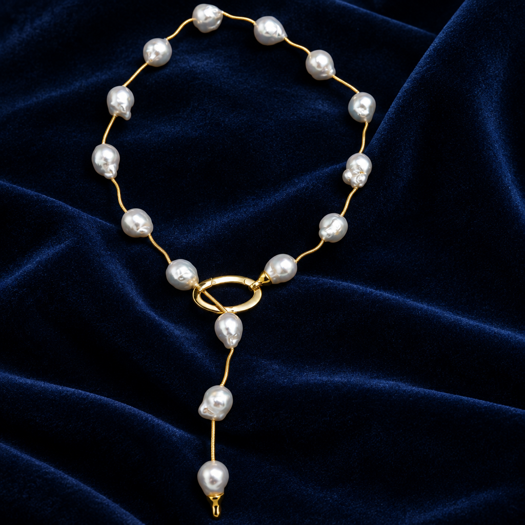 Baroque Australian South Sea Pearl Necklace 22 Inch – 14K Yellow Gold Spacers on a blue velvet cloth