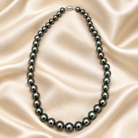 Tahitian Pearl Strand Necklace with 18K White Gold Clasp on a cream-colored satin background