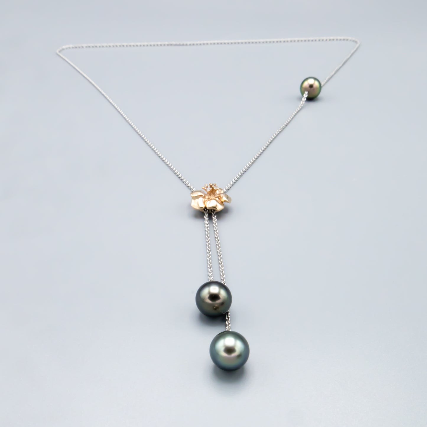 Tahitian pearl necklace with rose gold flower centerpiece - detail shot