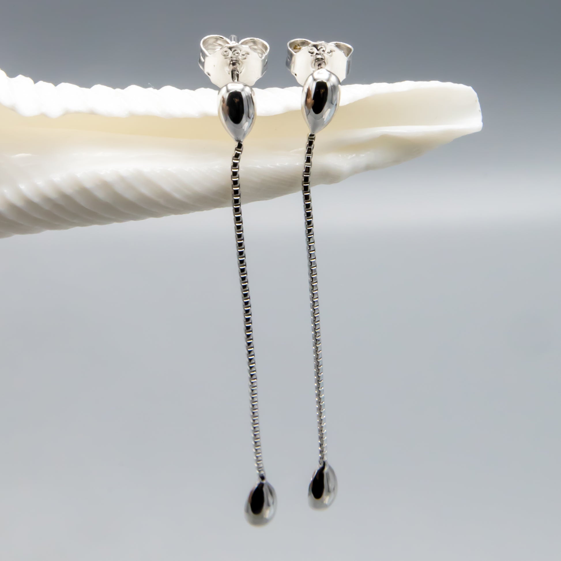 Sterling silver peach pearl earring jackets worn, elegant dangle style