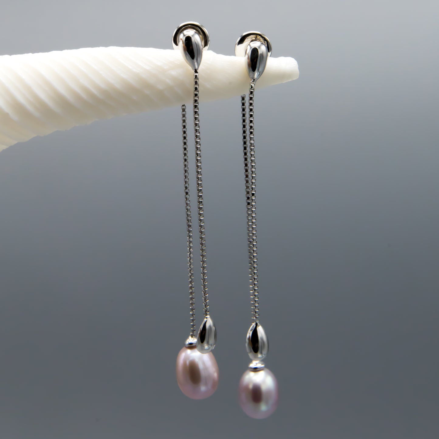 Sterling silver pearl earring jackets close-up, mauve teardrop freshwater pearls