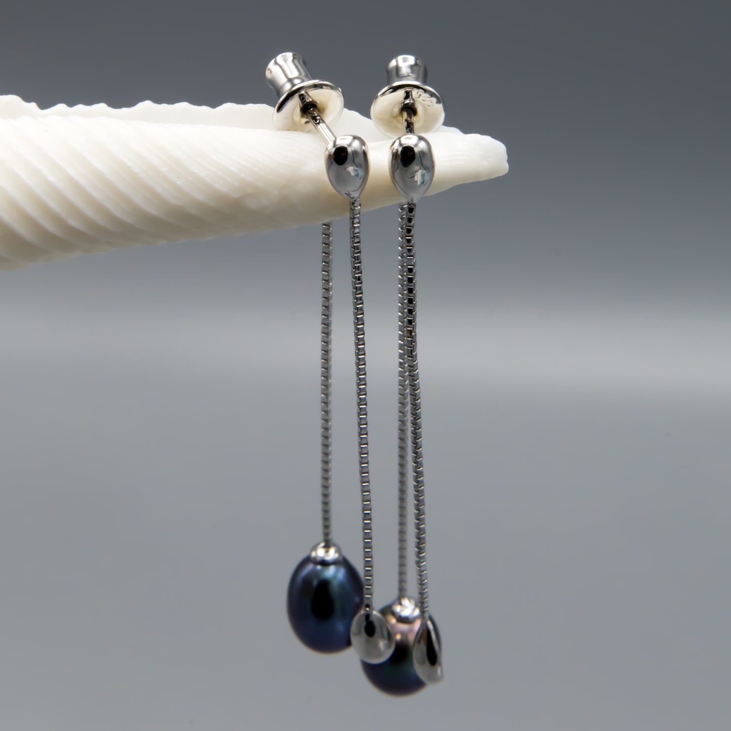Black pearl earring jacket detail view highlighting sterling silver setting