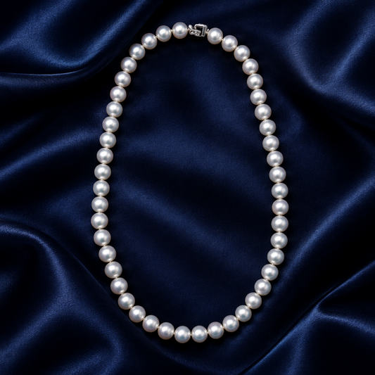 Hanadama Akoya Pearl Necklace 18in 8.5-9mm 14K White Gold Diamond Clasp on a blue sating background