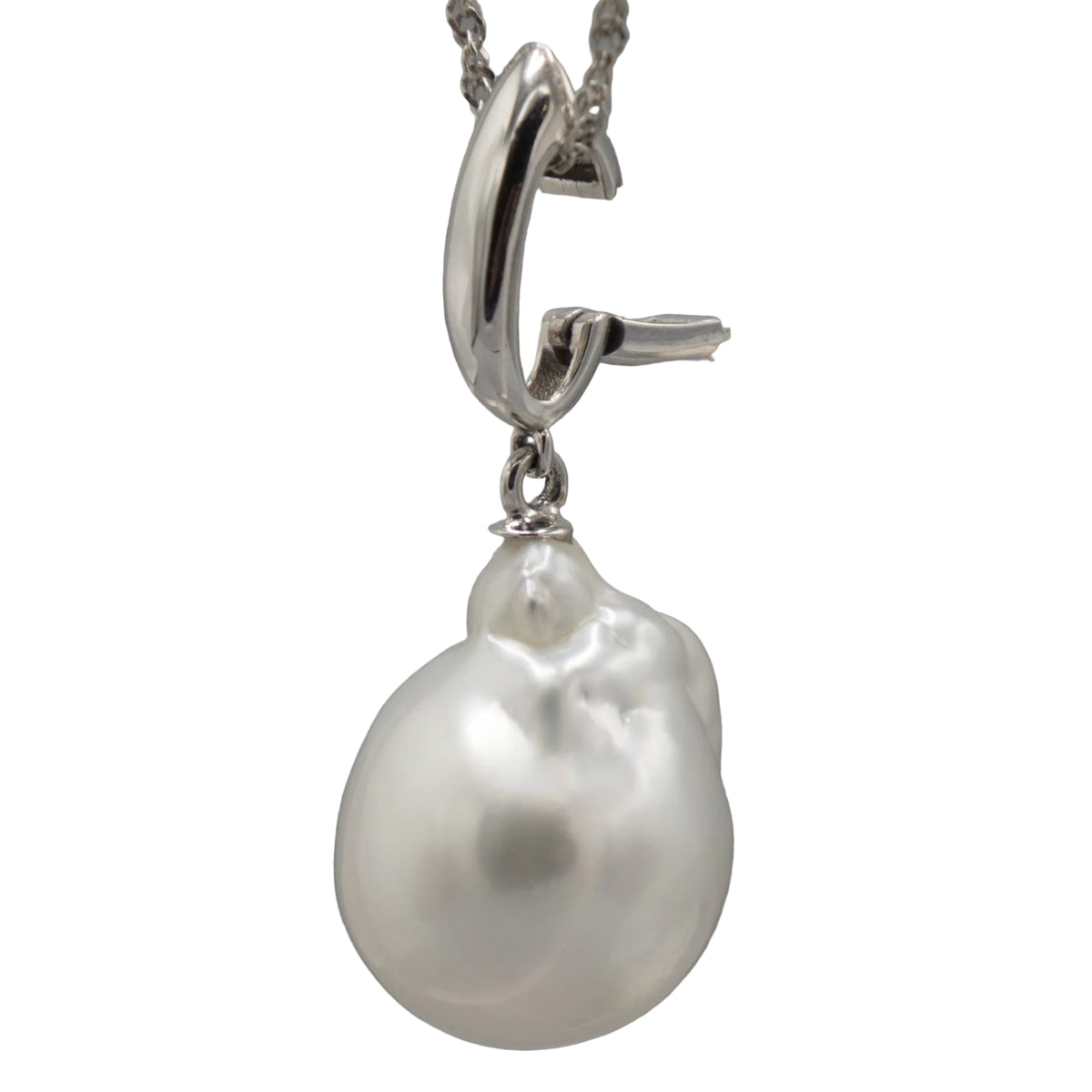 A single white baroque south sea pearl enhancer pendant in a silver clasp, shown against a white background--clasp open right side view.