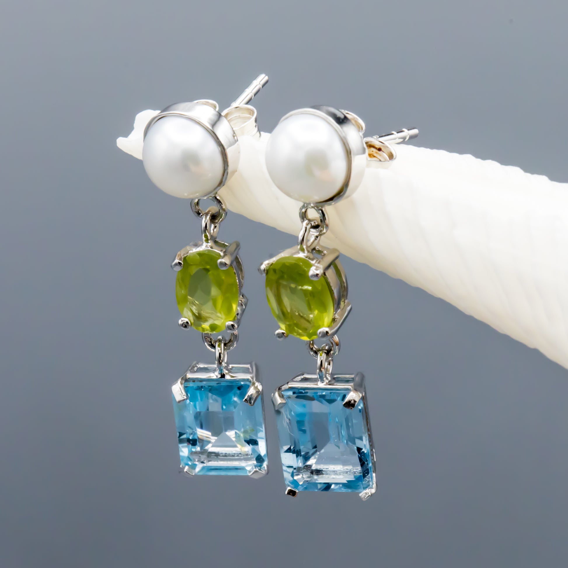 Pearl and gemstone sterling silver earrings showing dangle style and craftsmanship
