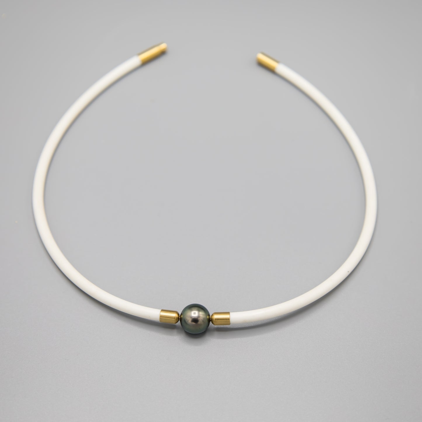 11.5mm Tahitian pearl choker necklace on white rubber cord with 14K gold clasp - closeup of pearl