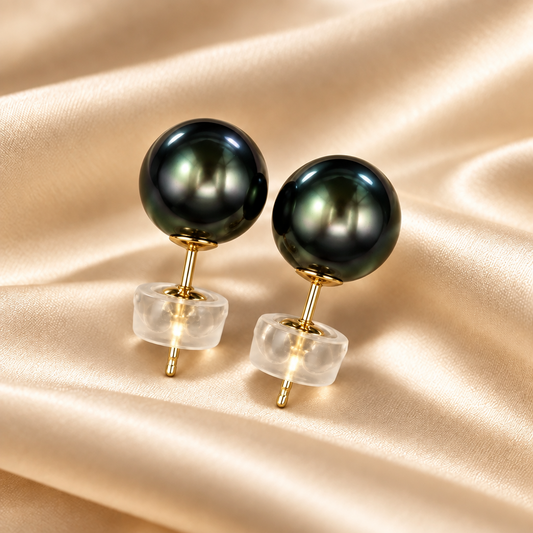 7.7mm Tahitian Pearl Stud Earrings in 14K Yellow Gold on cream-colored satin — Holly Zhang Pearl Gallery