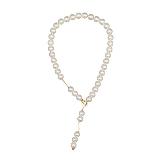 Holly Zhang Japanese Akoya saltwater cultured pearl lariat necklace styled as a loop with a cascading pearl drop and 14K yellow gold diamond clasp.