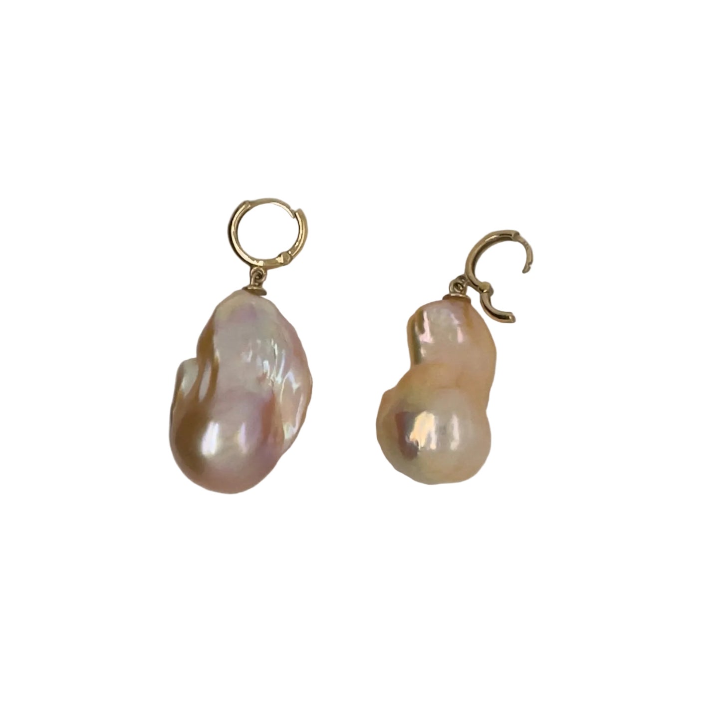 Close-up of peach baroque cultured pearl earrings with 14K yellow gold lever back