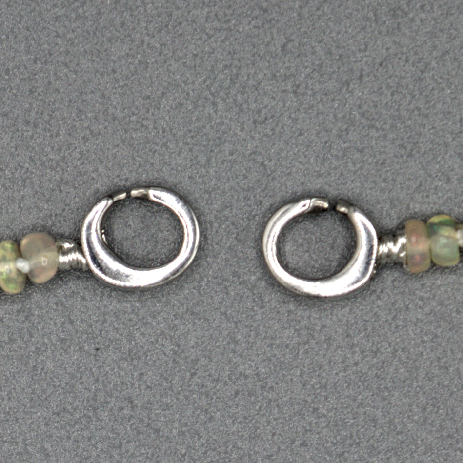 African opal necklace clasp detail, sterling silver clasp and opal bead texture