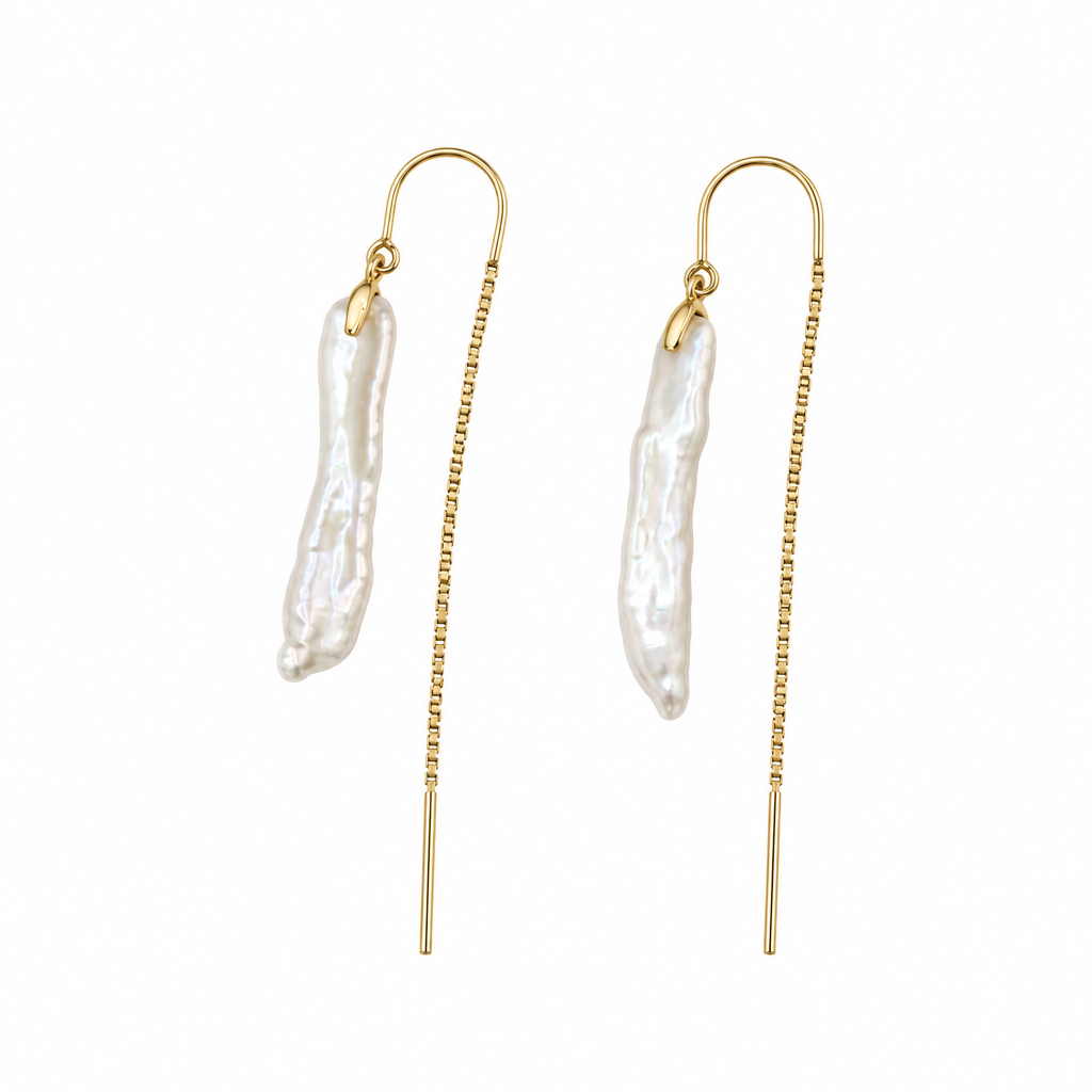 Keshi pearl threader earrings in 14K yellow gold showing textured white pearls and fine chains on white