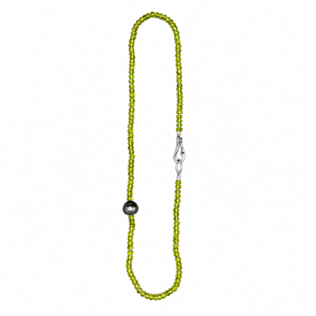 Peridot & Tahitian Pearl Necklace showing green beads, dark pearl and silver clasp on white background