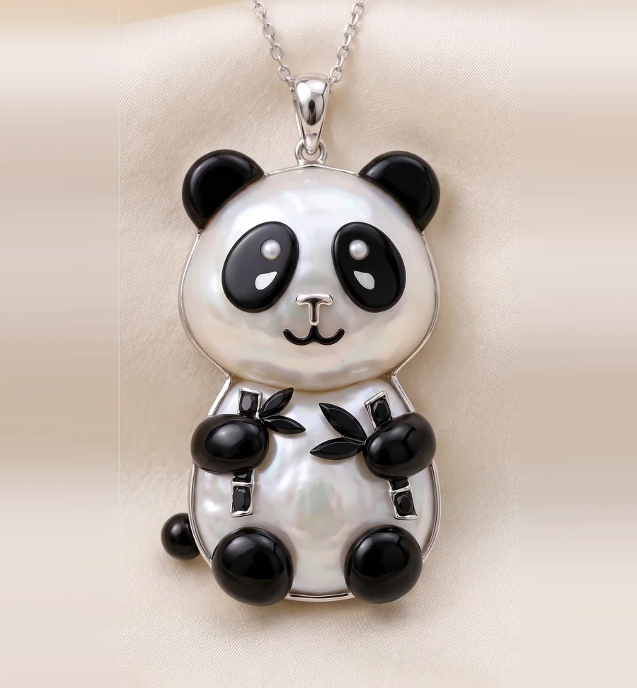 A panda pendant with a pearly white body, black ears and paws, small pearl eyes and bamboo